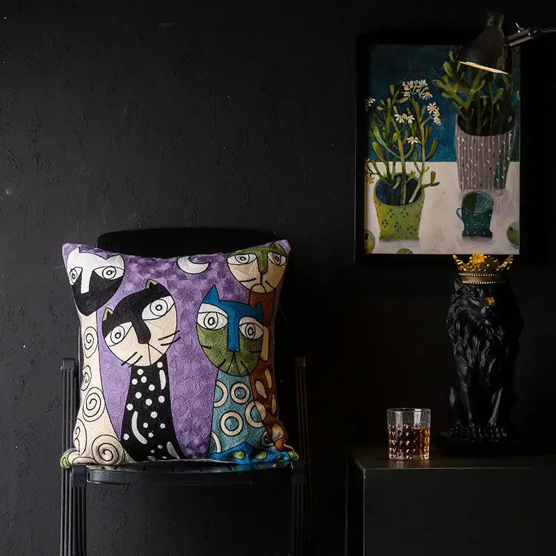 Purple cushion cover with embroidered cartoon cats in christmas picasso style by decorbites for sofa and bed