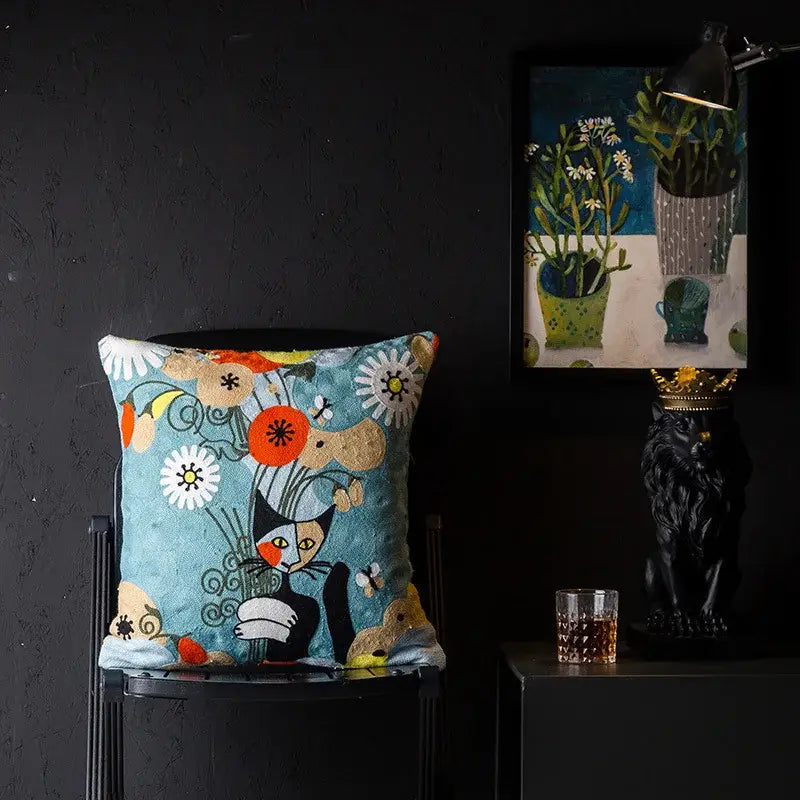 Teal cushion cover with whimsical black cat embroidery and colorful flowers decorbites christmas picasso style design