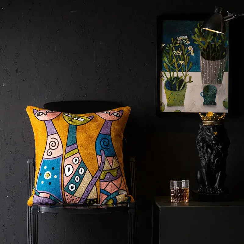 Vibrant yellow cushion cover with embroidered abstract cats in colorful geometric patterns decorbites christmas picasso style