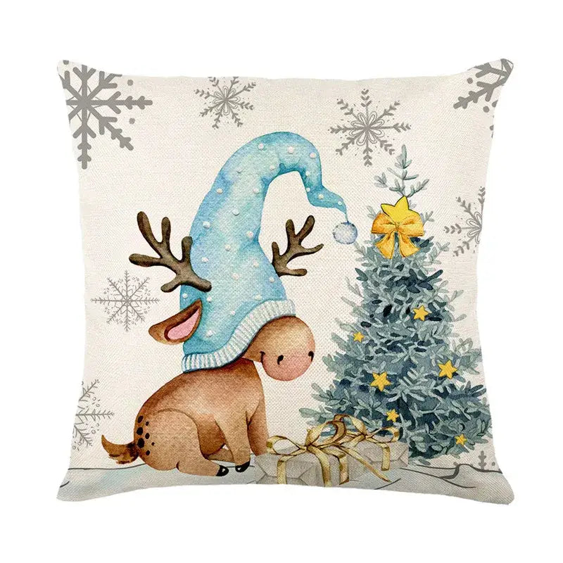Beige decorbites christmas pillowcase featuring a cartoon reindeer in a blue polka dot hat by decorated christmas tree