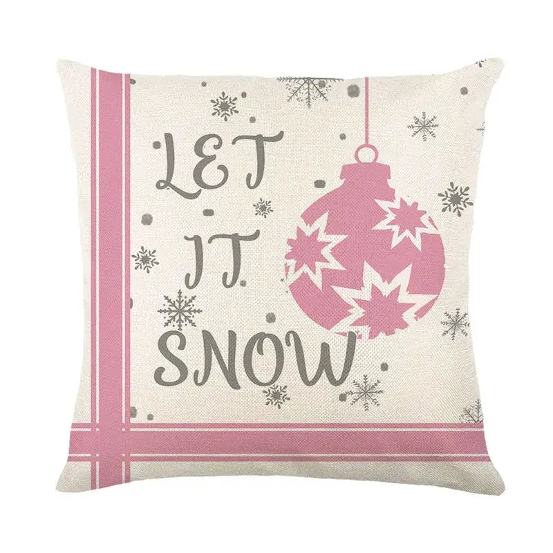 Cozy cream-colored decorbites christmas pillowcase featuring pink christmas ornament and let it snow script design