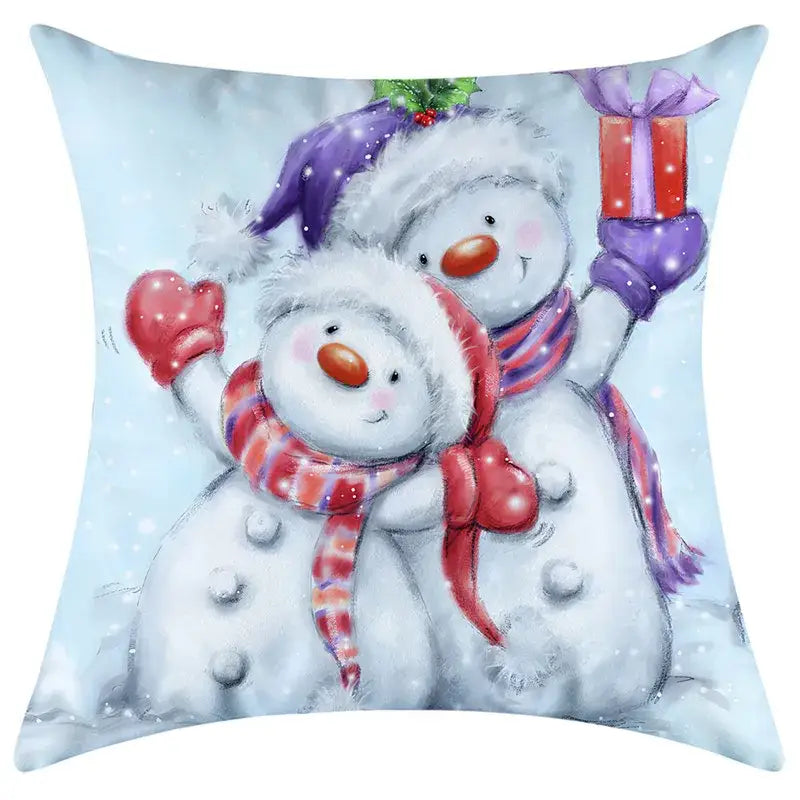 Cute white snowman couple pillow with red and purple scarves on light blue decorbites christmas pillowcase fabric
