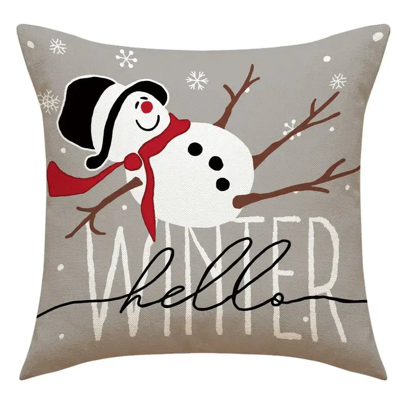 Gray throw pillow with cheerful snowman print wearing black hat and red scarf for santa claus living room decor