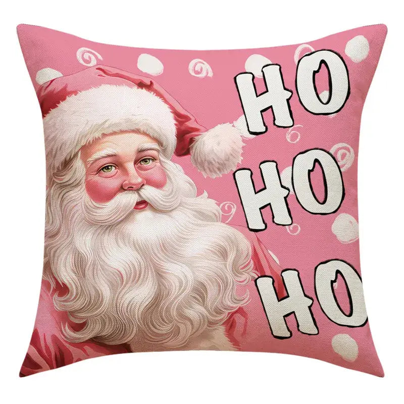 Pink throw pillow featuring a vintage-style santa claus illustration with snowman print for living room decor