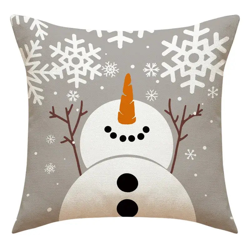 Gray throw pillow with snowman print featuring an orange carrot nose and snowflakes for living room decor by decorbites santa claus collection