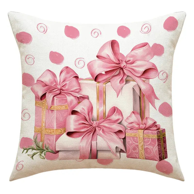 Pink gift-wrapped boxes with satin bows on a cream-colored cushion next to a DecorBites™ santa claus snowman print pillowcase for living room decor