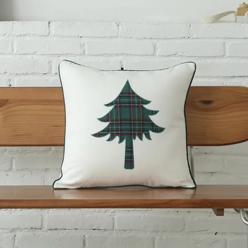 White cotton cushion cover with green plaid christmas tree design and black trim from decorbites christmas plaid collection