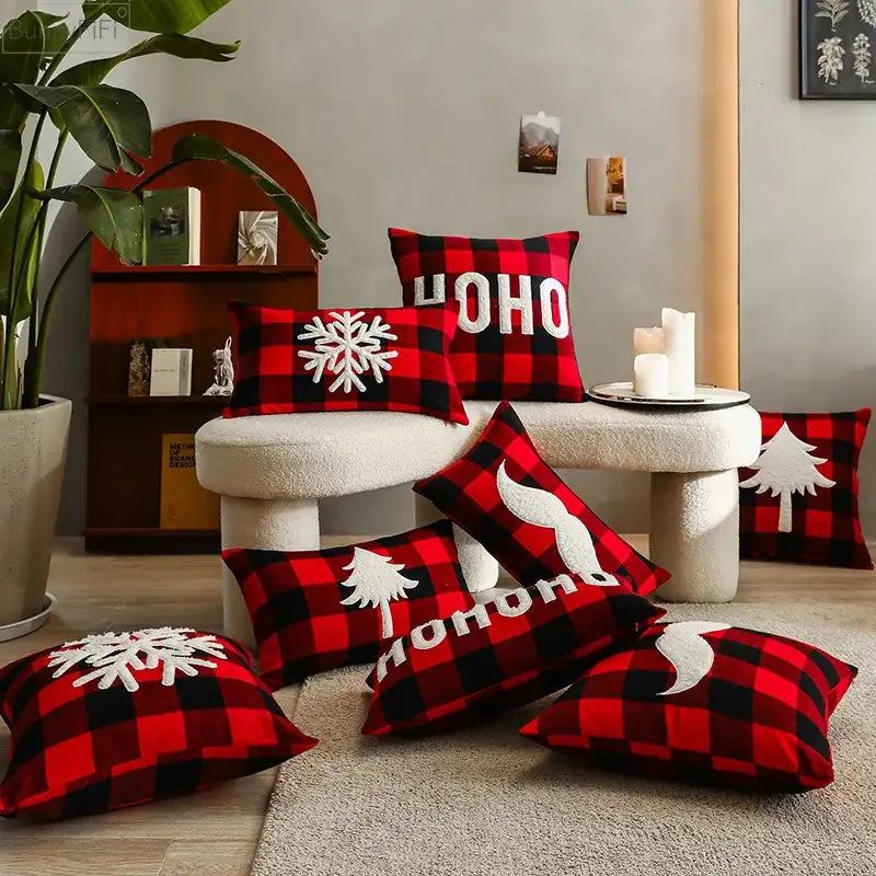 Red and black plaid cushion cover with white embroidered snowflakes trees and ho ho text by decorbites christmas plaid