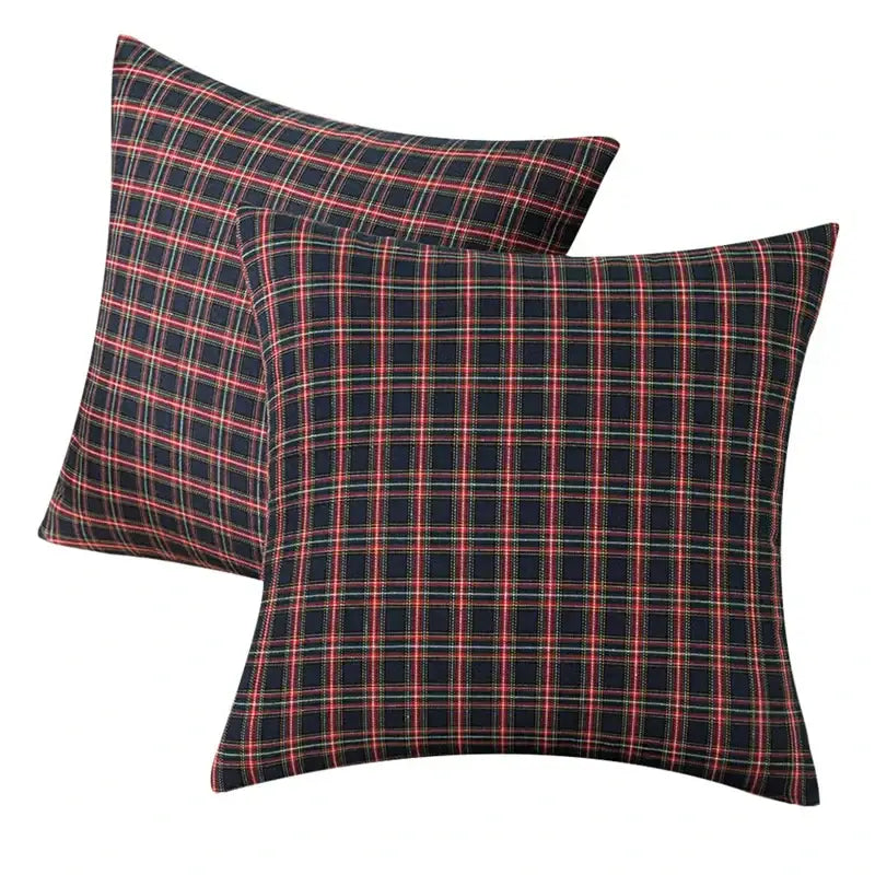 Square pillow covers with a classic decorbites christmas plaid pattern in red green and white on navy for holiday decor