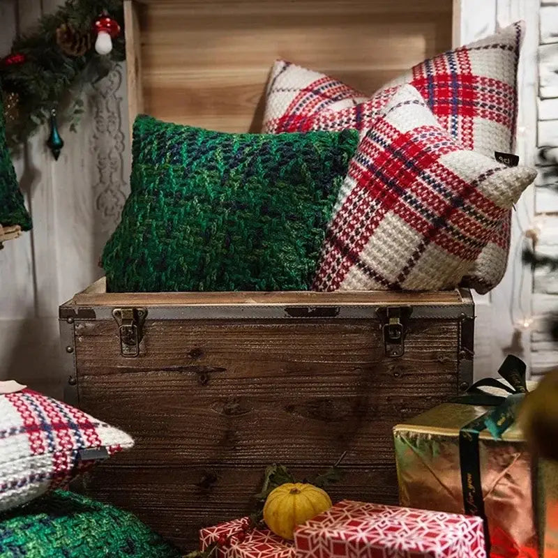 Rustic wooden trunk with metal latches and weathered finish beside decorbites christmas plaid weave cushion cover