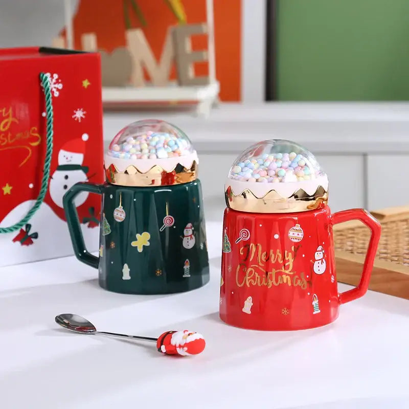 Decorbites christmas planet ceramic mugs with red and green gold-trimmed snow globe lids filled with colorful candies