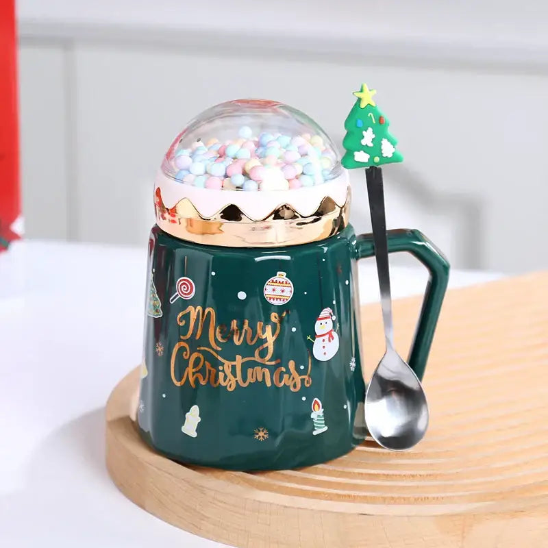 Dark green ceramic mug with gold foil merry christmas script and pastel candy lid from decorbites christmas planet collection