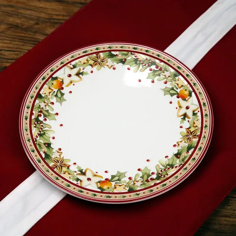 A festive white ceramic plate with a holiday wreath design from decorbites christmas porcelain tableware set