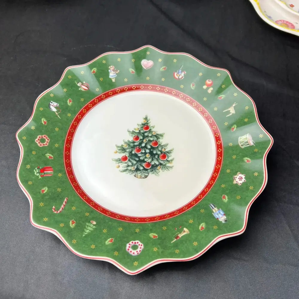 Green ceramic christmas plate with painted tree and festive border from decorbites christmas porcelain tableware set