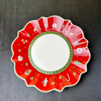 Vibrant red ceramic plate with scalloped edges featuring festive candy canes and snowmen in the decorbites christmas porcelain tableware set