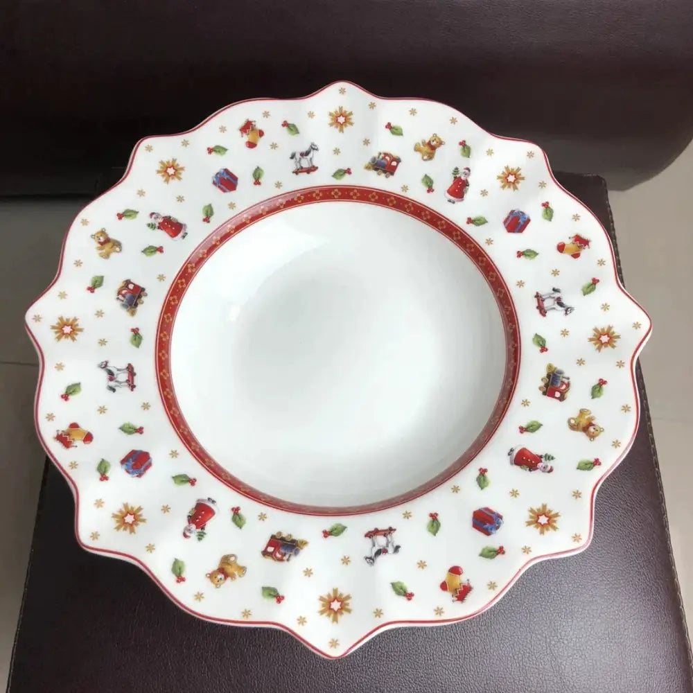 White ceramic bowl with scalloped edges featuring red and gold festive teddy bear and train design from DecorBites christmas porcelain tableware set
