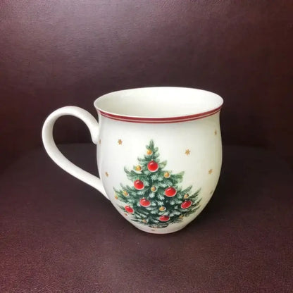 White ceramic mug with festive christmas tree design and red rim in decorbites christmas porcelain tableware set