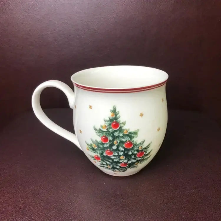 White ceramic mug with festive christmas tree design and red rim in decorbites christmas porcelain tableware set