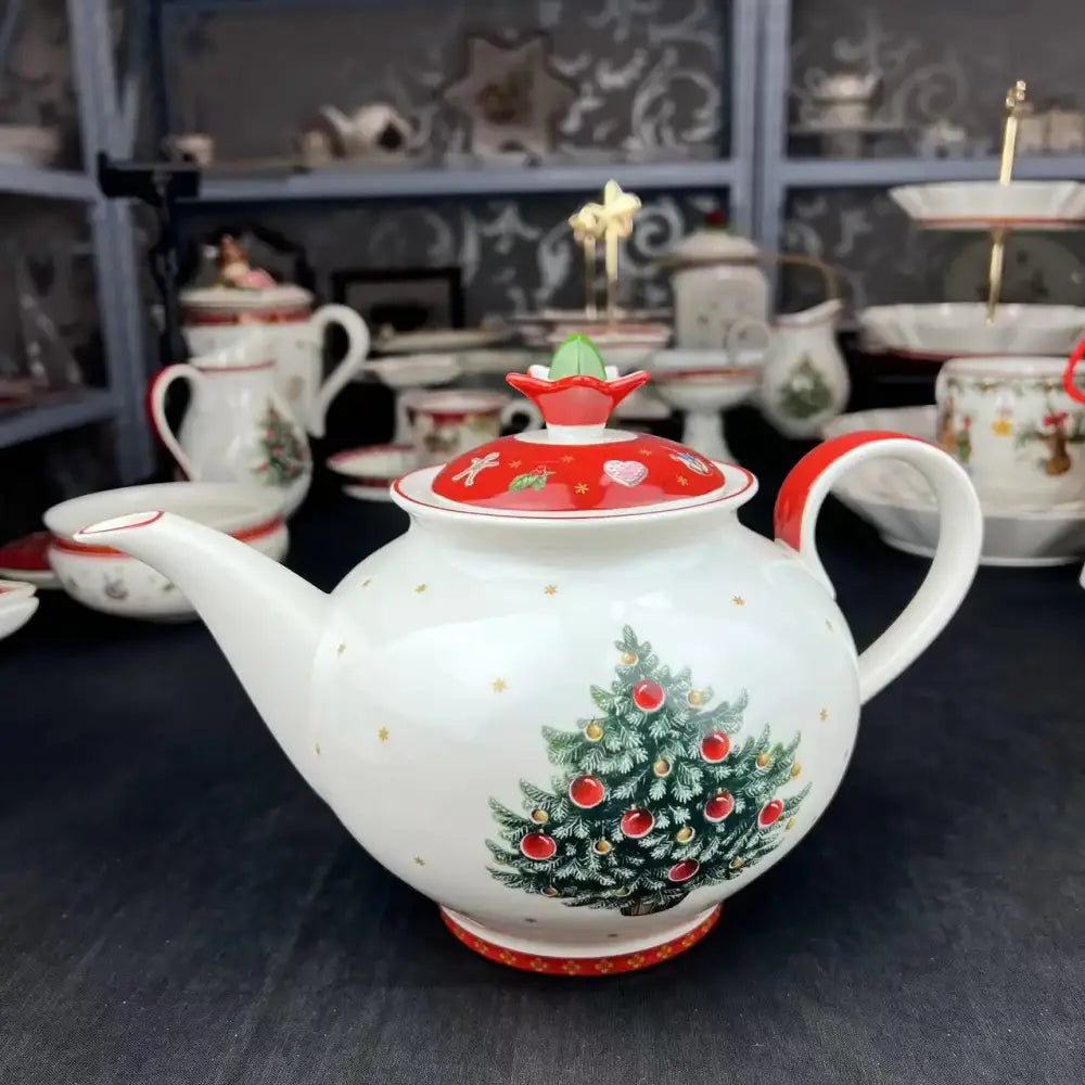 White ceramic teapot with festive christmas tree design and red lid from decorbites christmas porcelain tableware set