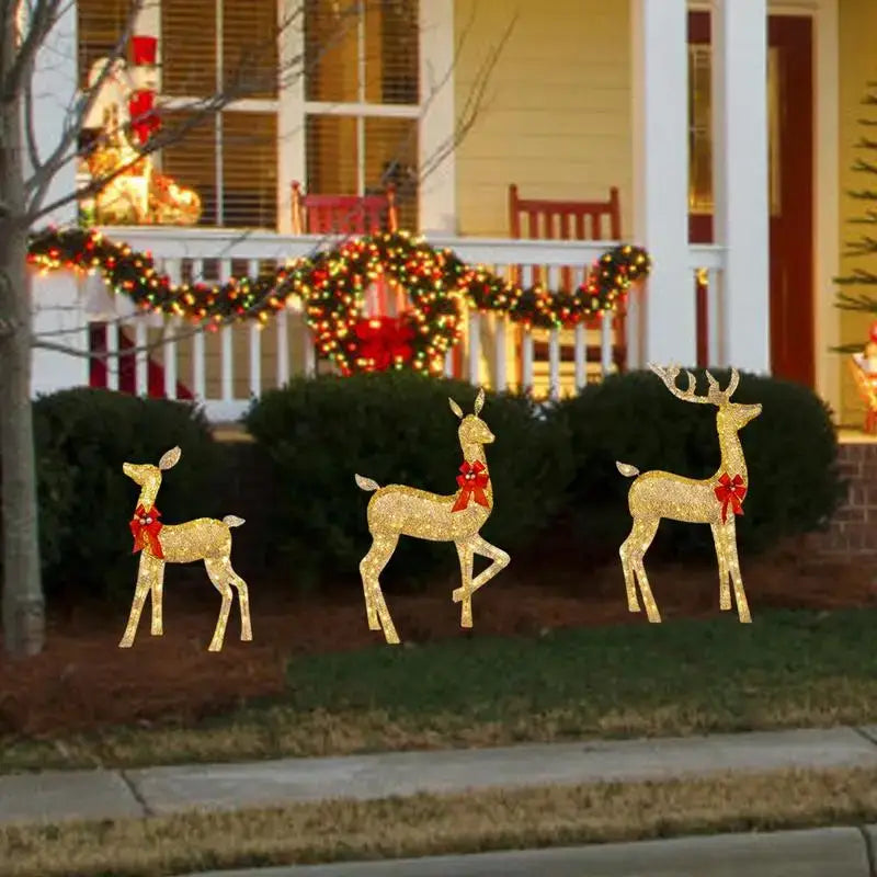 Three golden glittery led light outdoor decor reindeer with red bows by decorbites christmas reindeer elk sculpture