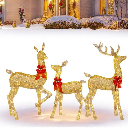 Three illuminated golden deer figurines with red bows and led lights by DecorBites Christmas reindeer outdoor decor