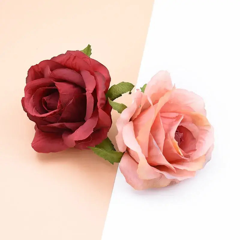 Two artificial silk roses in deep burgundy and soft peach in the DecorBites™ christmas rose arch wall garden wreath