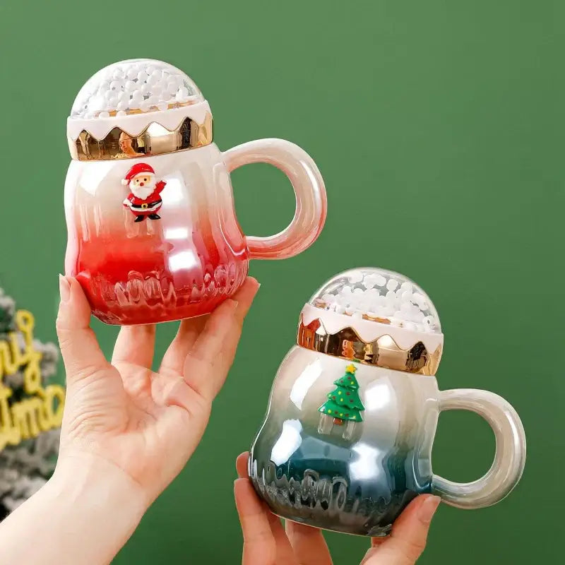 Two festive ceramic mugs with gradient colors and snow-covered domes featuring decorbites christmas santa designs