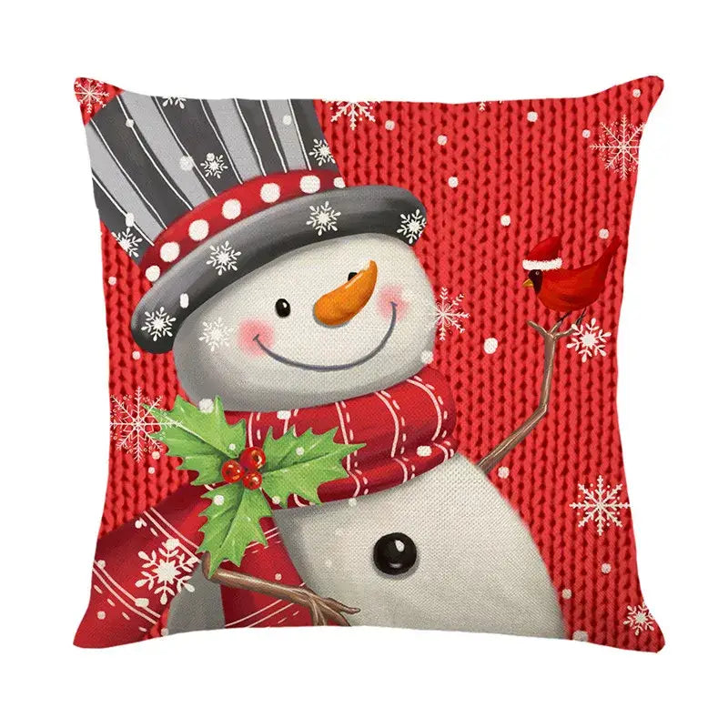 Red pillow cover featuring a cheerful snowman with a gray striped hat red scarf and holly sprig by decorbites christmas santa