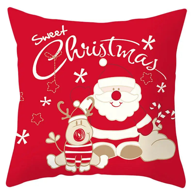 Red christmas-themed pillow cover featuring cartoon santa claus and reindeer with white snowflake patterns by decorbites christmas santa