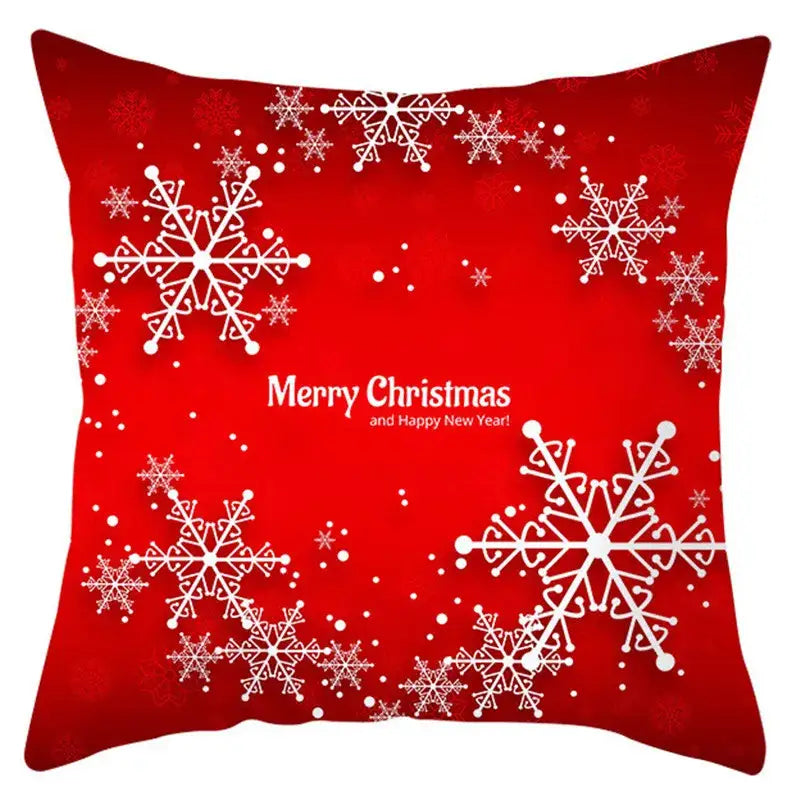 Red christmas-themed pillow cover with white snowflake patterns and merry christmas text by decorbites christmas santa