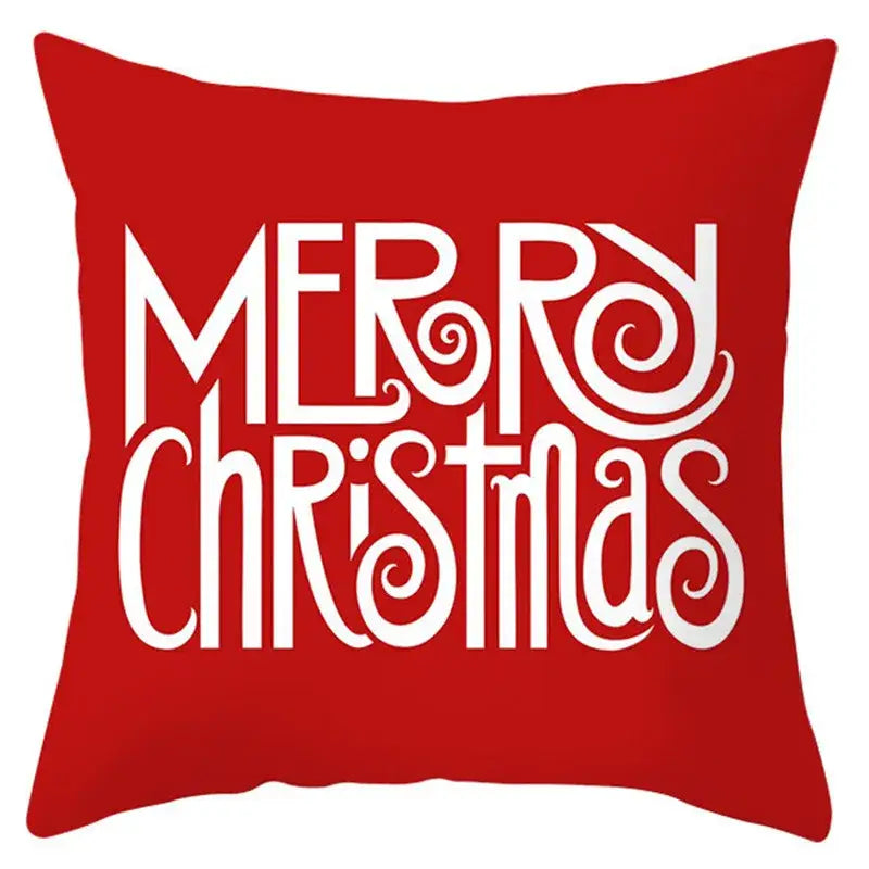 Red pillow cover with white merry christmas text in decorative script from decorbites christmas santa claus collection