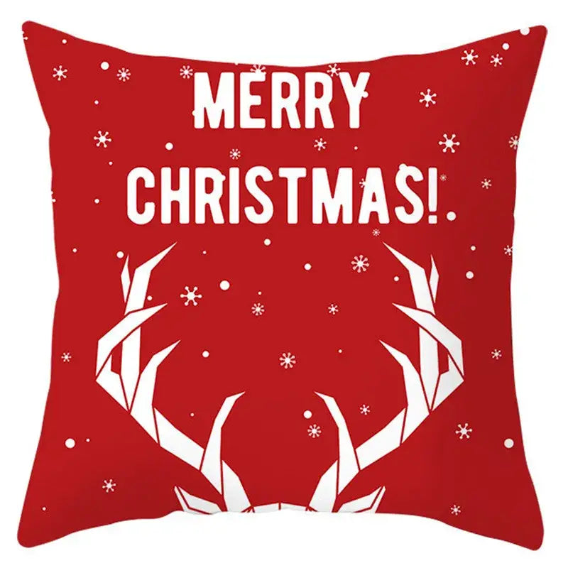Red christmas-themed pillow cover with white merry christmas text and stylized reindeer antlers for decorbites christmas santa collection
