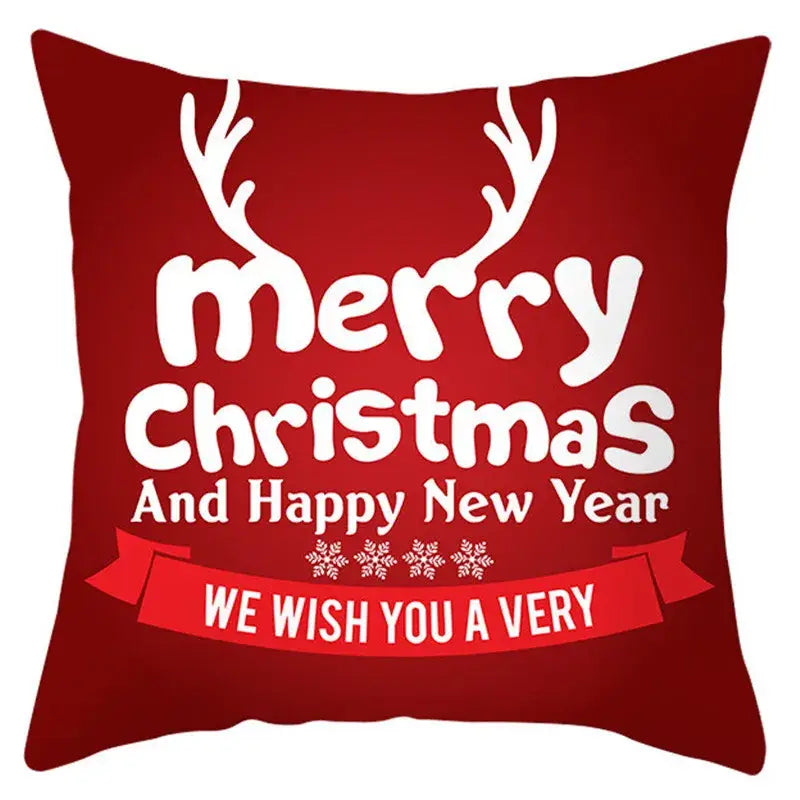 Red christmas-themed pillow cover with white reindeer antlers and holiday text by decorbites christmas santa
