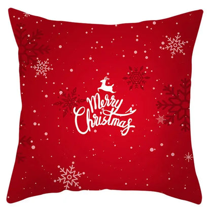 Red christmas-themed pillow cover with white snowflakes and merry christmas text by decorbites christmas santa