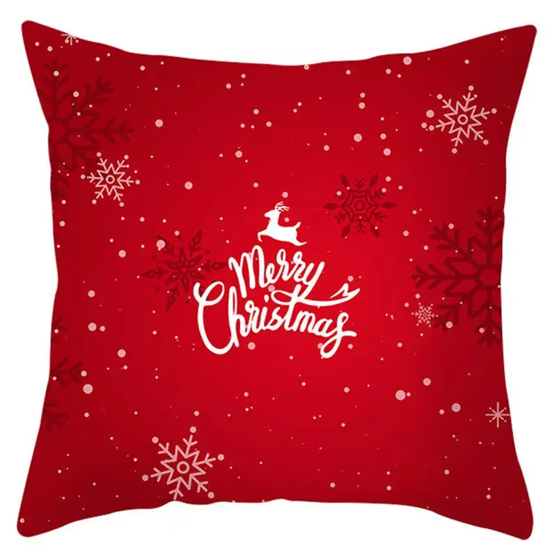Red christmas-themed pillow cover with white snowflakes and merry christmas text by decorbites christmas santa