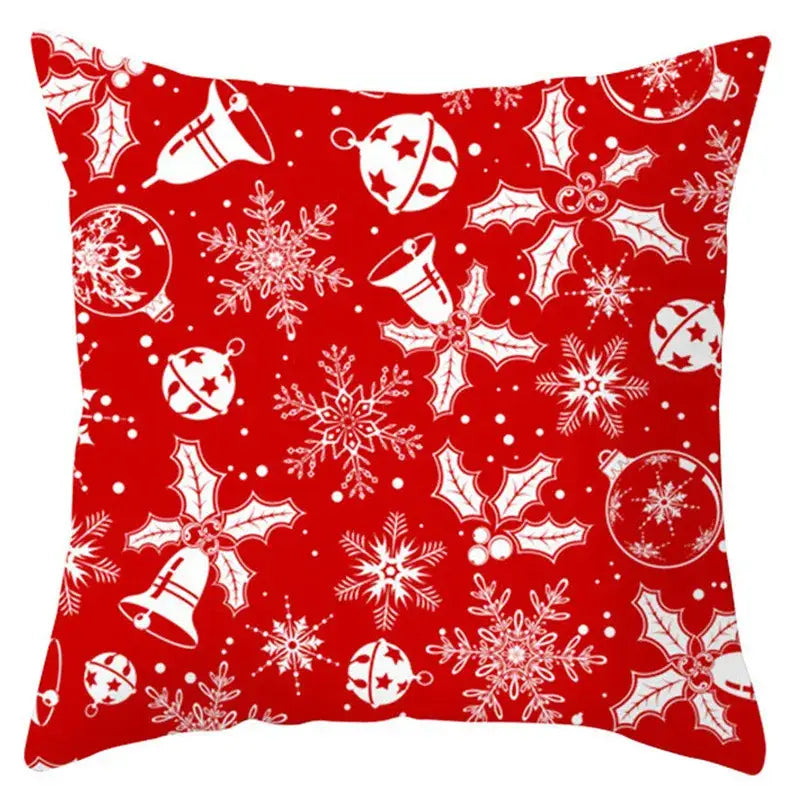 Red christmas-themed pillow cover with white santa claus bells ornaments snowflakes holly leaves by decorbites christmas santa