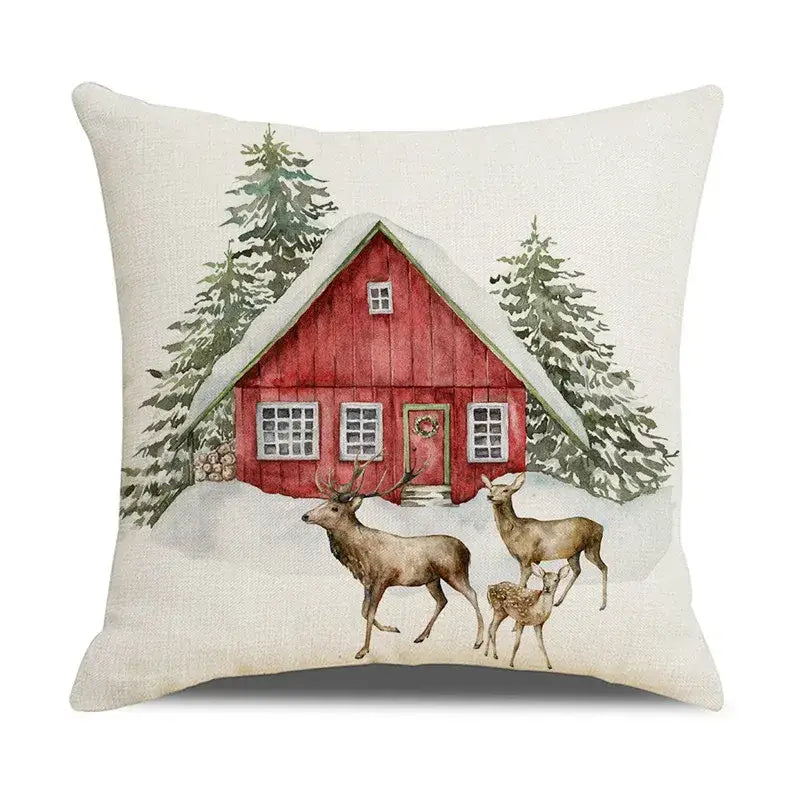 Beige linen pillow cover featuring decorbites christmas snow elk design with red cabin and deer in snowy landscape