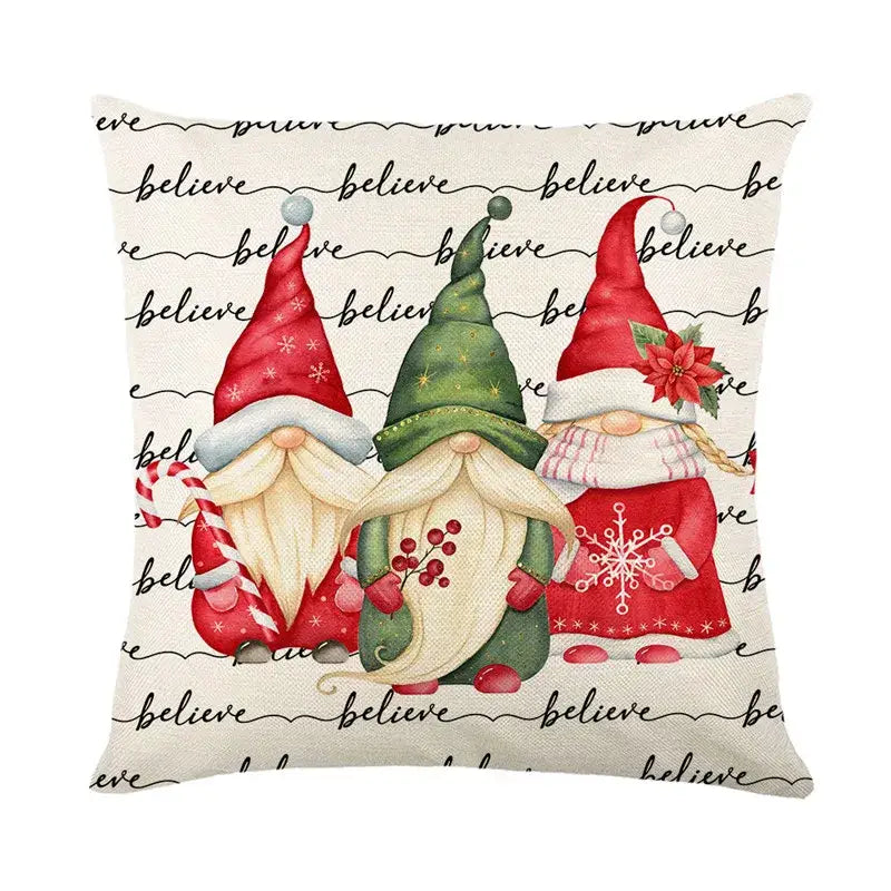Decorbites christmas snow pillow cover featuring three red and green gnomes with white beards on cream background