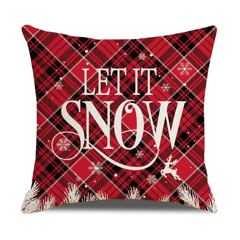 Red and black plaid pillow cover featuring white let it snow text snowflakes and christmas snow elk design by decorbites christmas snow