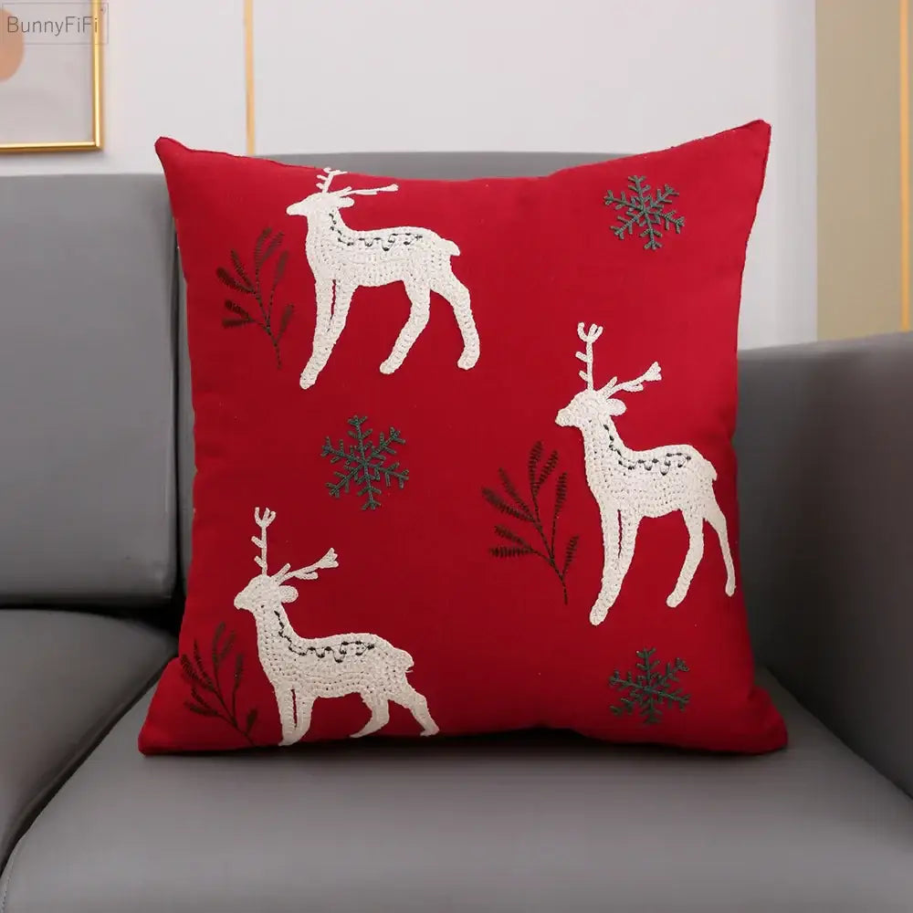 Red cushion cover with embroidered white snowflake deer design from decorbites christmas snowflake collection