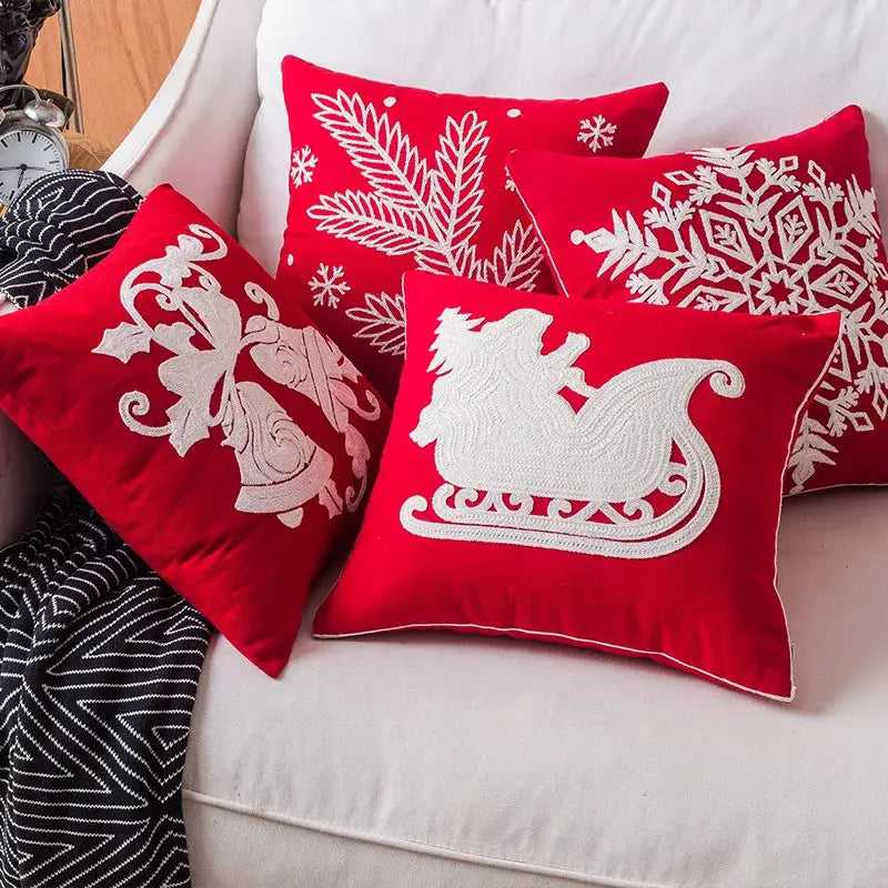 Red velvet christmas throw pillows with white embroidered holiday designs from decorbites christmas snowflake elk collection