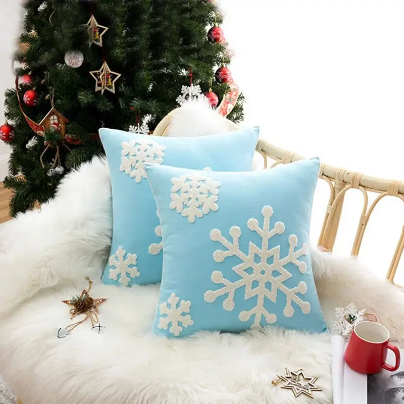 Light blue cushion cover with white embroidered snowflakes by DecorBites christmas snowflake for festive decor