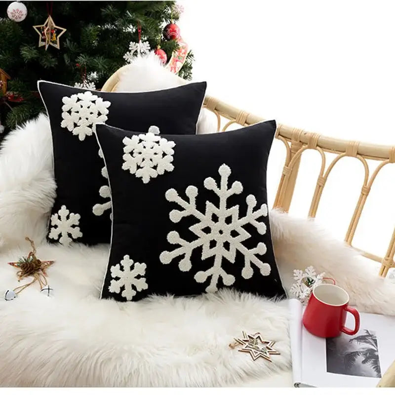 Black cushion cover with white christmas snowflake embroidered design by DecorBites for home decor and noel party