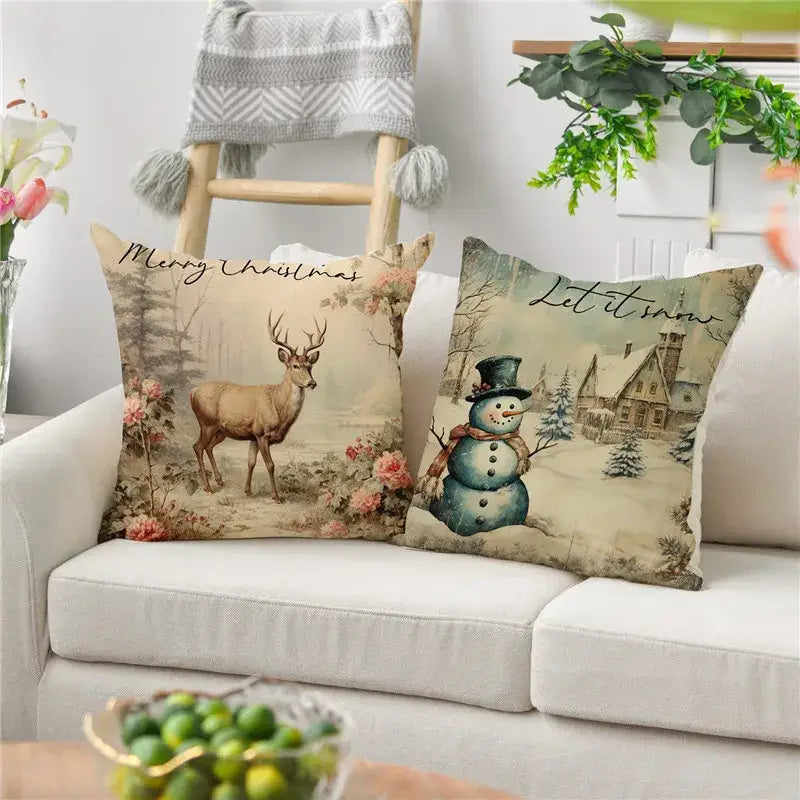 Two festive decorbites christmas snowman deer pillowcases with vintage scenes on white sofa for holiday decor