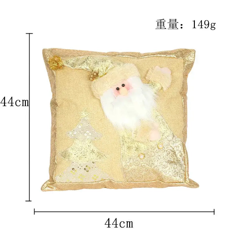 A plush gold embroidered pillowcase featuring a three-dimensional santa claus with sequined trees and gold embellishments