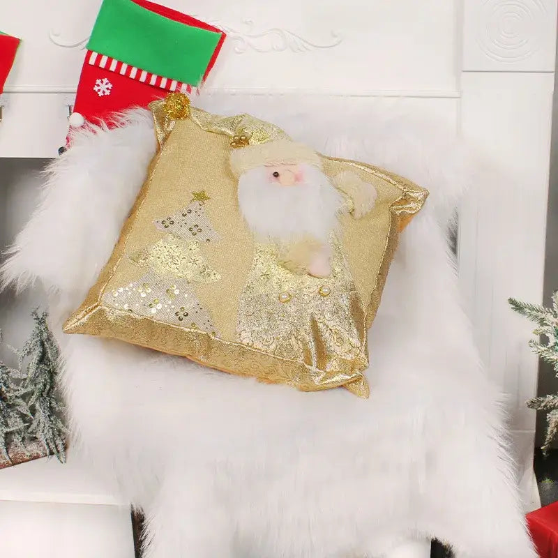 Gold embroidered pillowcase with gold sequins featuring a plush santa claus with white fur and gold trim