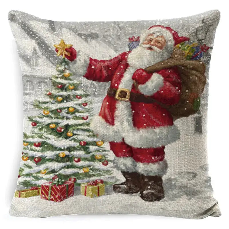 Decorbites christmas snowman santa claus pillow cover in red and white linen with festive tree gold ornaments and gifts