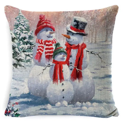 Square pillow cover by decorbites featuring christmas snowman and santa claus print on linen for festive decor