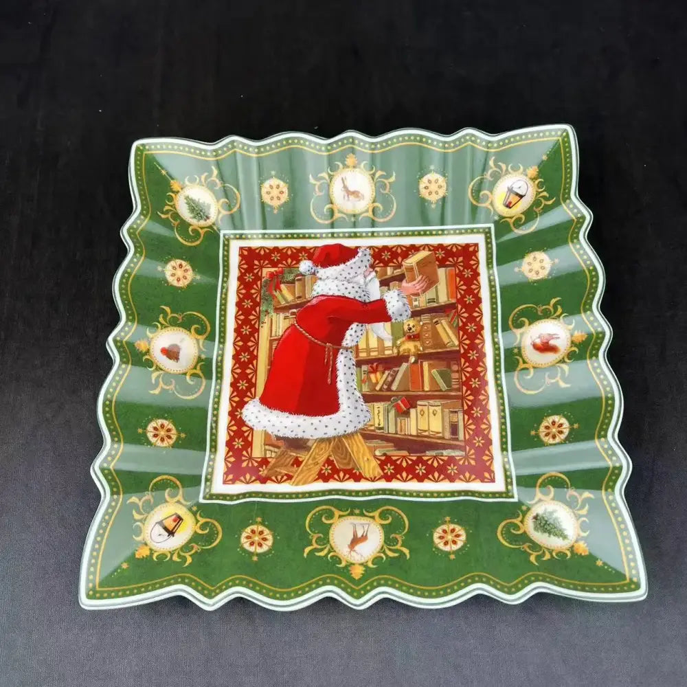 Green ceramic serving platter with scalloped edges featuring santa claus illustration for decorbites christmas tableware
