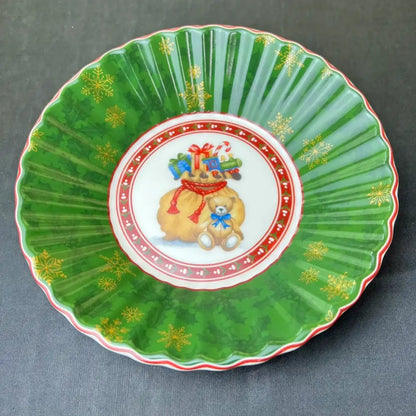 Green ceramic Christmas plate with scalloped edges and gold snowflakes from DecorBites Christmas tableware set